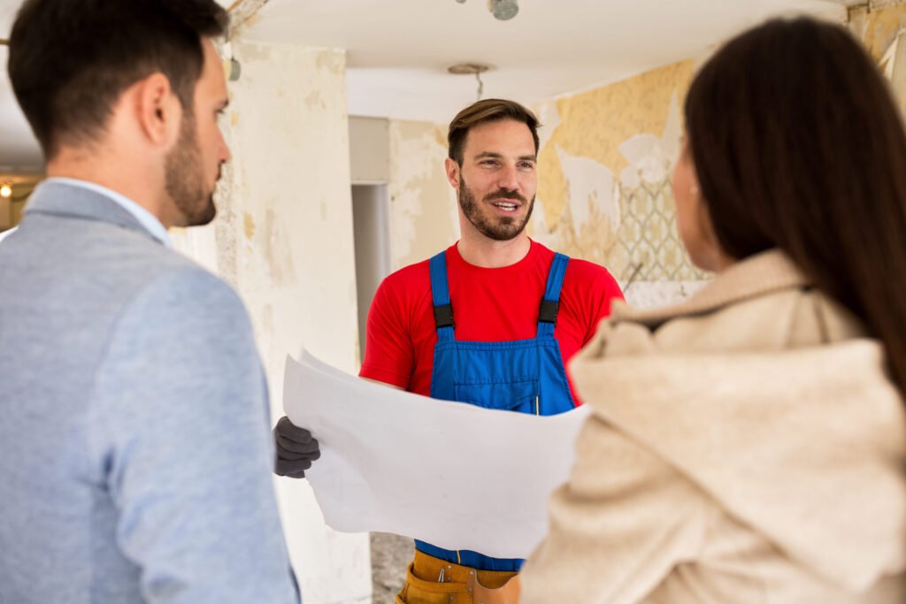 Plumber consults with young couple about renovations their house